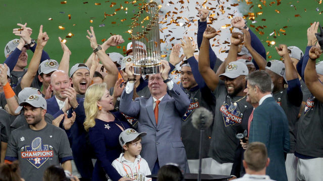 HOUSTON, TEXAS - NOVEMBER 05: Houston Astros owner Jim Crane lifts the commissioner's trophy after defeating the Philadelphia Phillies 4-1 to win the 2022 World Series in Game Six of the 2022 World Series at Minute Maid Park on November 05, 2022 in Houston, Texas.