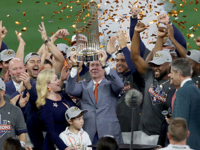 HOUSTON, TEXAS - NOVEMBER 05: Houston Astros owner Jim Crane lifts the commissioner's trophy after defeating the Philadelphia Phillies 4-1 to win the 2022 World Series in Game Six of the 2022 World Series at Minute Maid Park on November 05, 2022 in Houston, Texas.