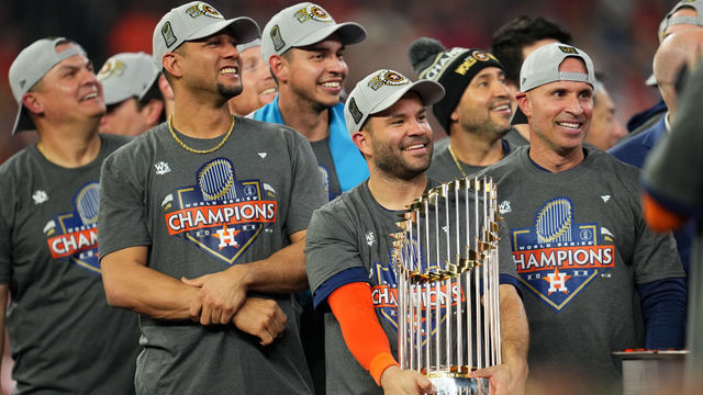 HOUSTON, TX - NOVEMBER 05: Jose Altuve #27 of the Houston Astros holds the Commissioners Trophy after the Astros took Game 6 against the Philadelphia Phillies to win the 2022 World Series at Minute Maid Park on Saturday, November 5, 2022 in Houston, Texas.