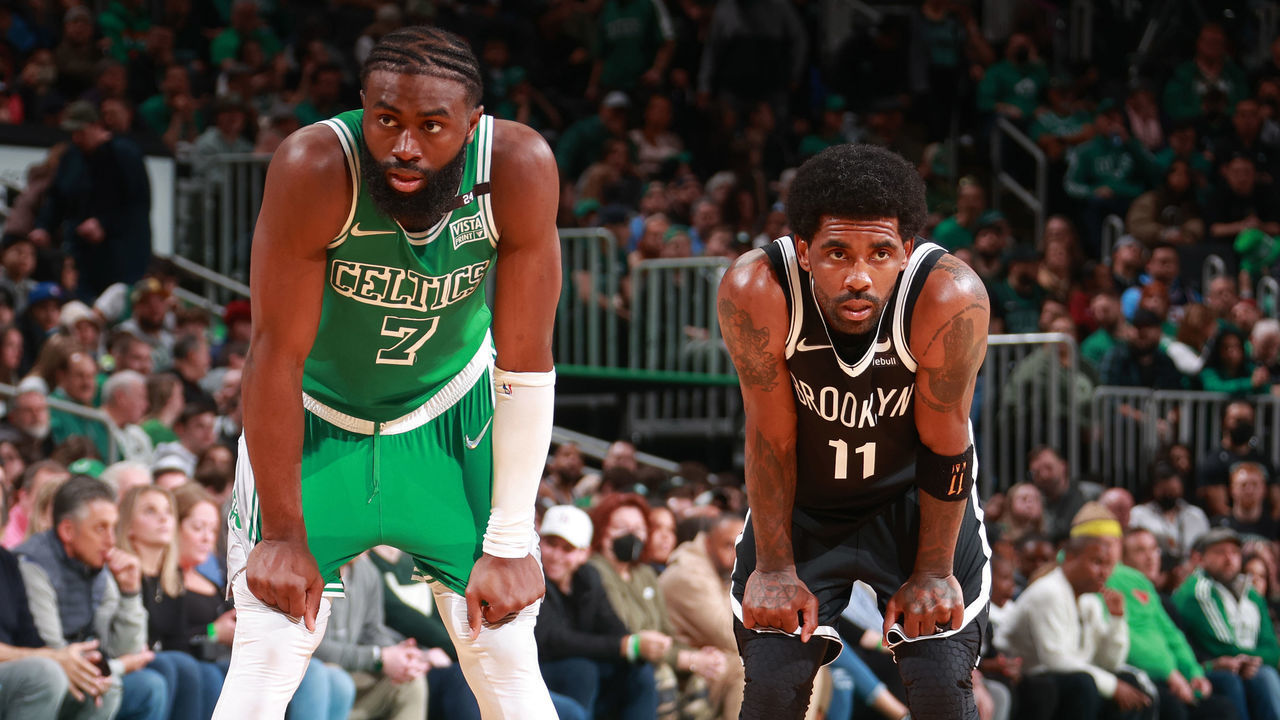 BOSTON, MA - MARCH 6: Jaylen Brown #7 of the Boston Celtics and Kyrie Irving #11 of the Brooklyn Nets looks on on March 6, 2022 at the TD Garden in Boston, Massachusetts. Mandatory Copyright Notice: Copyright 2022 NBAE