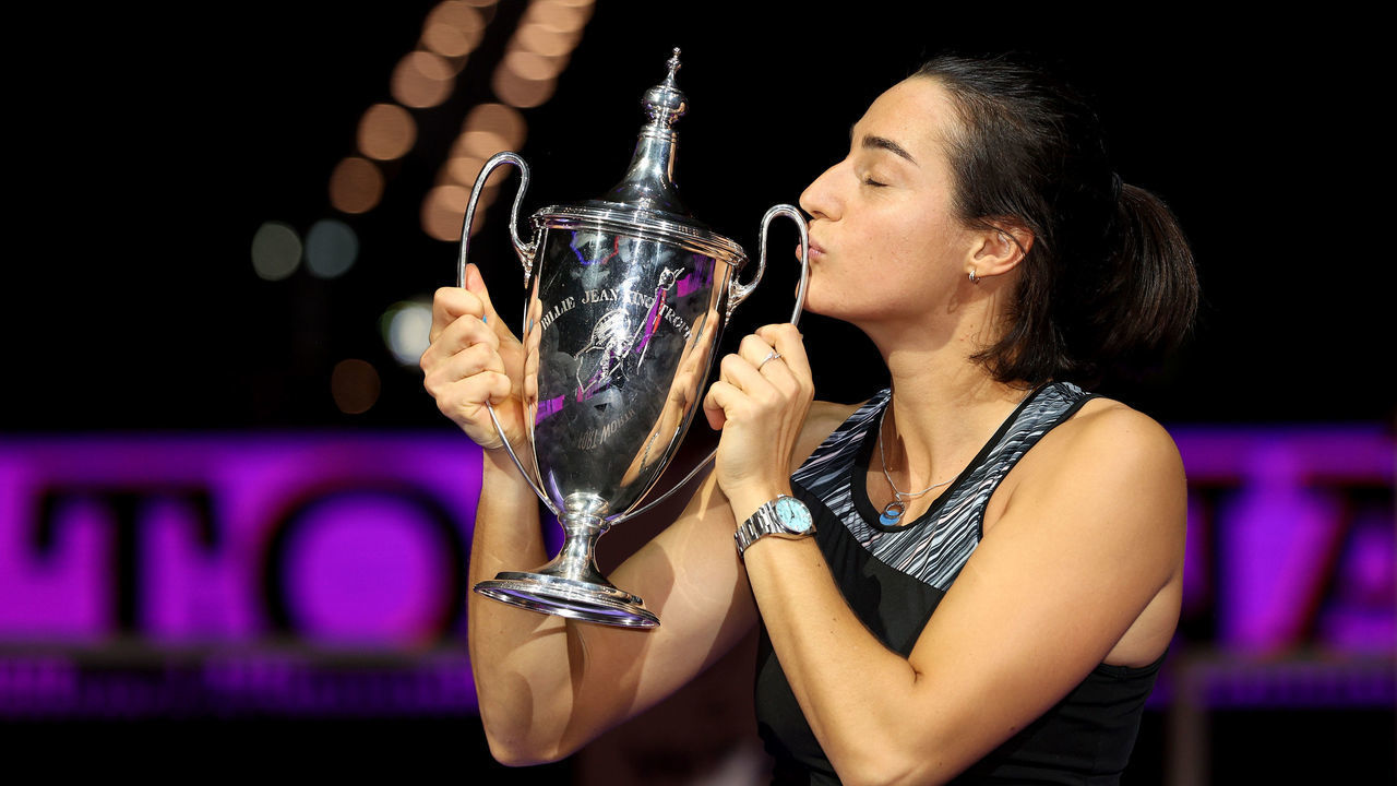 FORT WORTH, TEXAS - NOVEMBER 07: Caroline Garcia of France celebrates with the Billie Jean King Trophy after defeating Aryna Sabalenka of Belarus in their Women's Singles Final match during the 2022 WTA Finals, part of the Hologic WTA Tour, at Dickies Arena on November 07, 2022 in Fort Worth, Texas.