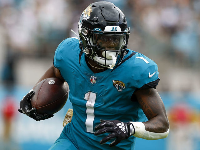 JACKSONVILLE, FL - NOVEMBER 06: Jacksonville Jaguars running back Travis Etienne Jr. (1) runs with the ball during the game between the Las Vegas Raiders and the Jacksonville Jaguars on November 6, 2022 at TIAA Bank Field in Jacksonville, Fl.