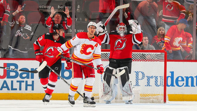 NEWARK, NJ - NOVEMBER 8: Ryan Graves #33 and Vitek Vanecek #41 of the New Jersey Devils celebrate their 3-2 win against the Calgary Flames during the third period on November 8, 2022 at the Prudential Center in Newark, New Jersey.