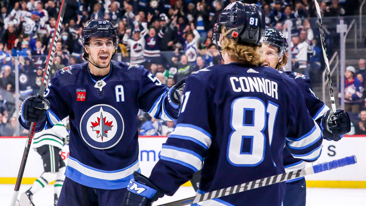 WINNIPEG, CANADA - NOVEMBER 8: Mark Scheifele #55, Kyle Connor #81 and Mason Appleton #22 of the Winnipeg Jets celebrate a second period goal against the Dallas Stars at the Canada Life Centre on November 8, 2022 in Winnipeg, Manitoba, Canada.