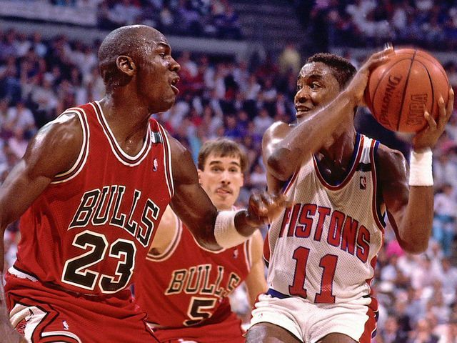 AUBURN HILLS, MI - 1988: Isiah Thomas #11 of the Detroit Pistons stops his drives against Michael Jordan #23 of the Chicago Bulls during an NBA game in 1988 at The Palace in Auburn Hills, Michigan. NOTE TO USER: User expressly acknowledges and agrees that, by downloading and/or using this Photograph, user is consenting to the terms and conditions of the Getty Images License Agreement. Mandatory Copyright Notice: Copyright 1988 NBAE