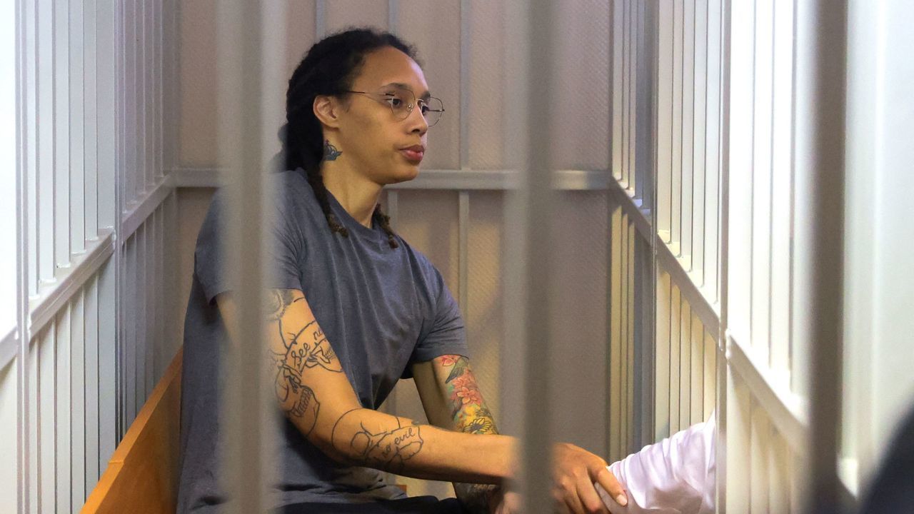 US Women's National Basketball Association (WNBA) basketball player Brittney Griner, who was detained at Moscow's Sheremetyevo airport and later charged with illegal possession of cannabis, sits inside a defendants' cage after the court's verdict during a hearing in Khimki outside Moscow, on August 4, 2022. - A Russian court found Griner guilty of smuggling and storing narcotics after prosecutors requested a sentence of nine and a half years in jail for the athlete.