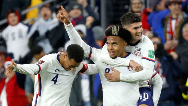 CINCINNATI, OH - NOVEMBER 12: Weston McKennie #8 of the United States is congratulated by Christian Pulisic #10 and Tyler Adams #4 after scoring a goal during the second half of the FIFA World Cup 2022 Qualifier match against Mexico at TQL Stadium on November 12, 2021 in Cincinnati, Ohio. The United States defeated Mexico 2-0.