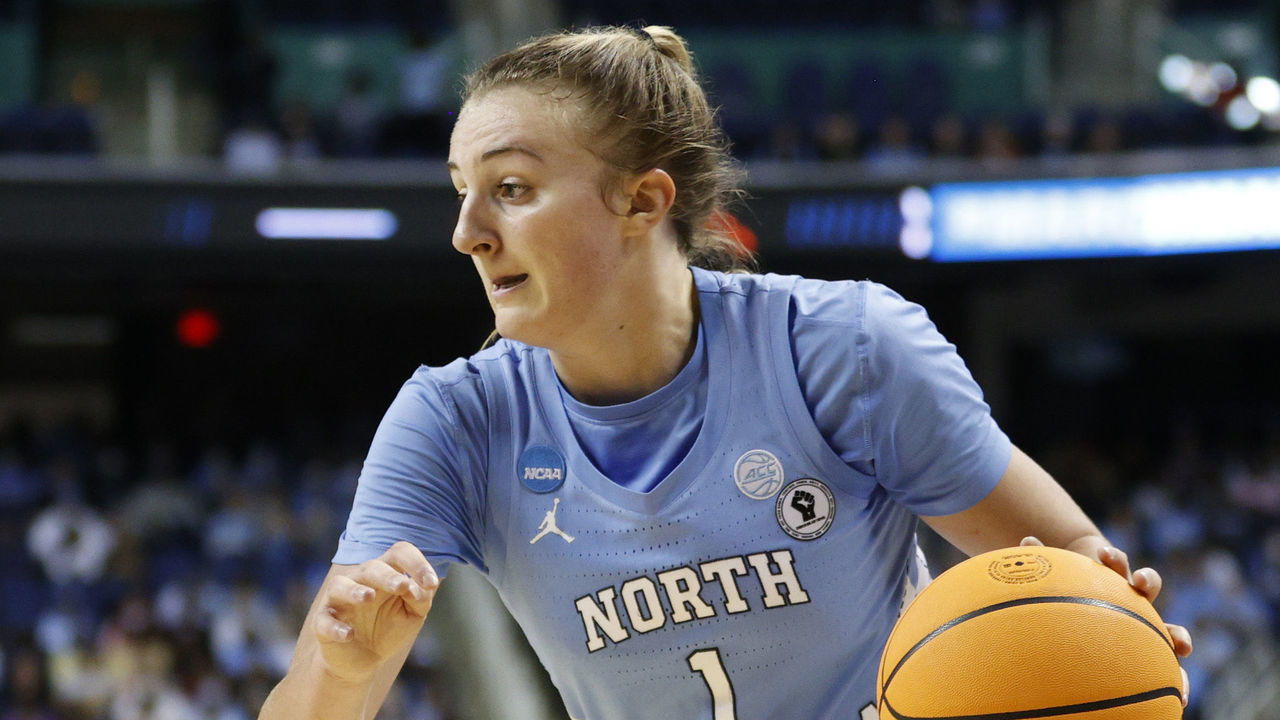 GREENSBORO, NORTH CAROLINA - MARCH 25: Alyssa Ustby #1 of the North Carolina Tar Heels dribbles as Victaria Saxton #5 of the South Carolina Gamecocks defends during the first half in the NCAA Women's Basketball Tournament Sweet 16 Round at Greensboro Coliseum Complex on March 25, 2022 in Greensboro, North Carolina.