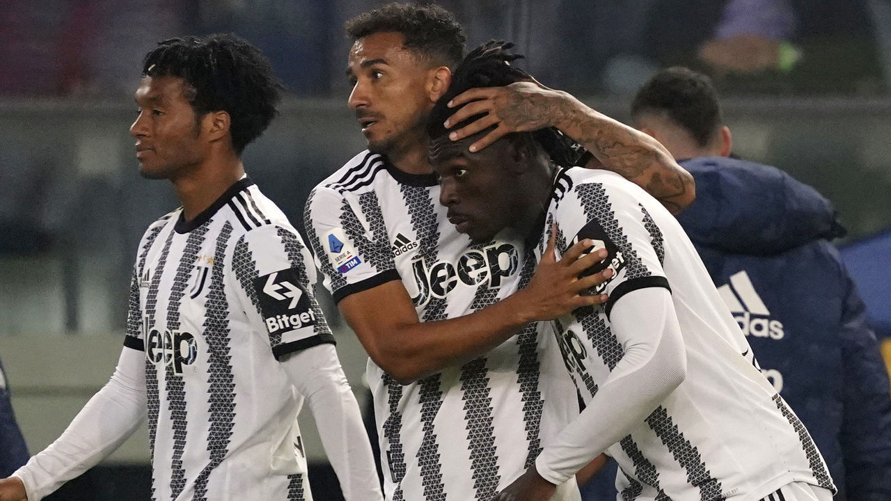 VERONA, ITALY - NOVEMBER 10: Moise Bioty Kean of Juventus celebrates his first goal with his teammates Danilo and Juan Cuadrado during the Serie A match between Hellas Verona and Juventus at Stadio Marcantonio Bentegodi on November 10, 2022 in Verona, Italy.