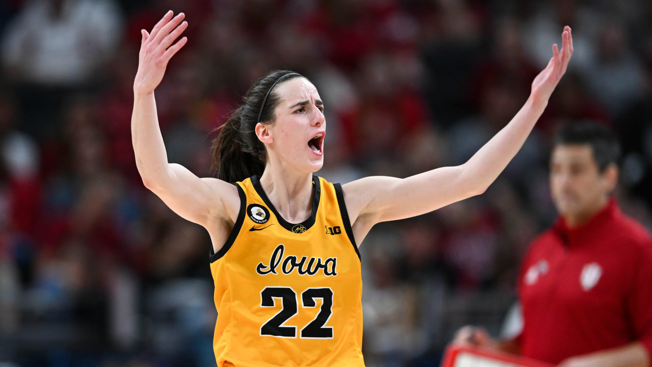 INDIANAPOLIS, IN - MARCH 6: Iowa guard Caitlin Clark (22) raises her arms in an effort to get the crowd cheering during the Women's Big Ten Tournament Championship college basketball game between the Indiana Hoosiers and the Iowa Hawkeyes on March 6, 2022 at Gainbridge Fieldhouse in Indianapolis, IN.