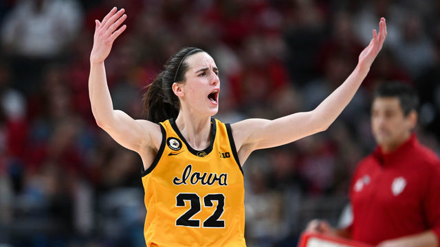 INDIANAPOLIS, IN - MARCH 6: Iowa guard Caitlin Clark (22) raises her arms in an effort to get the crowd cheering during the Women's Big Ten Tournament Championship college basketball game between the Indiana Hoosiers and the Iowa Hawkeyes on March 6, 2022 at Gainbridge Fieldhouse in Indianapolis, IN.