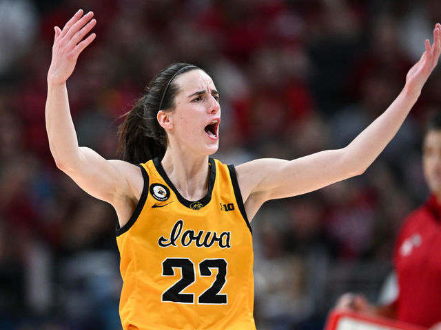 INDIANAPOLIS, IN - MARCH 6: Iowa guard Caitlin Clark (22) raises her arms in an effort to get the crowd cheering during the Women's Big Ten Tournament Championship college basketball game between the Indiana Hoosiers and the Iowa Hawkeyes on March 6, 2022 at Gainbridge Fieldhouse in Indianapolis, IN.