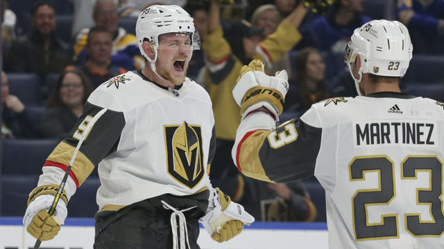 BUFFALO, NEW YORK - NOVEMBER 10: Jack Eichel #9 and Alec Martinez #23 of the Vegas Golden Knights celebrate after an empty-net goal by Eichel for a hat trick during the third period of an NHL hockey game at KeyBank Center on November 10, 2022 in Buffalo, New York.