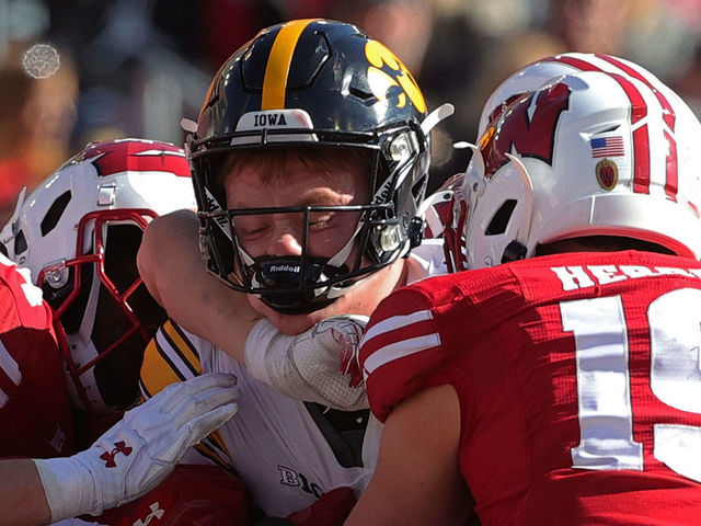 MADISON, WISCONSIN - OCTOBER 30: Spencer Petras #7 of the Iowa Hawkeyes scores a touchdown during the second half against the Wisconsin Badgers at Camp Randall Stadium on October 30, 2021 in Madison, Wisconsin. The Badgers defeated the Hawkeyes 27-7.
