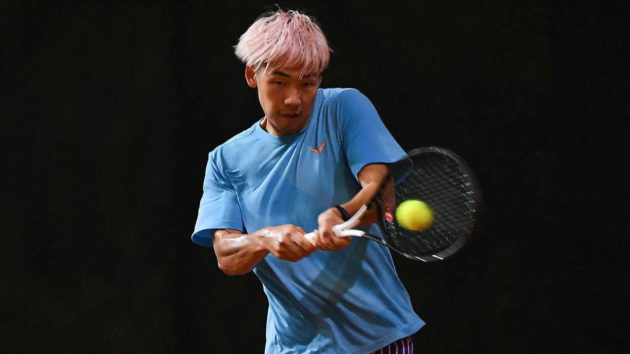 CHANGSHA, CHINA - SEPTEMBER 23: Zheng Baoluo of China in action during the Men's singles third round against Bai Yan of China on day 5 of the 2020 CTA Tour 1000 Changsha Open at Roland Garros Red Clay Tennis Park on September 23, 2020 in Changsha, China.