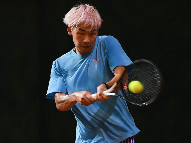 CHANGSHA, CHINA - SEPTEMBER 23: Zheng Baoluo of China in action during the Men's singles third round against Bai Yan of China on day 5 of the 2020 CTA Tour 1000 Changsha Open at Roland Garros Red Clay Tennis Park on September 23, 2020 in Changsha, China.