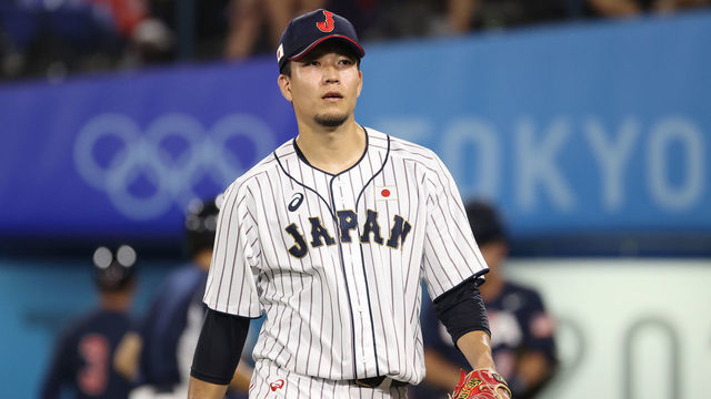 YOKOHAMA, JAPAN - AUGUST 07: Pitcher Kodai Senga #21 of Team Japan reacts after the sixth inning against Team United Staes during the gold medal game between Team United States and Team Japan on day fifteen of the Tokyo 2020 Olympic Games at Yokohama Baseball Stadium on August 07, 2021 in Yokohama, Kanagawa, Japan.