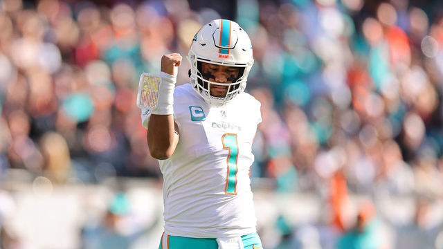 CHICAGO, ILLINOIS - NOVEMBER 06: Tua Tagovailoa #1 of the Miami Dolphins celebrates a touchdown against the Chicago Bears at Soldier Field on November 06, 2022 in Chicago, Illinois.
