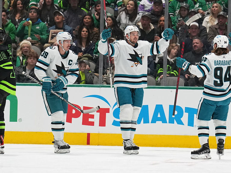 From left to right, San Jose Sharks center Tomas Hertl, left wing Alexander  Barabanov (94), right wing Timo Meier and center Logan Couture (39)  celebrate a goal by defenseman Erik Karlsson (obscured)