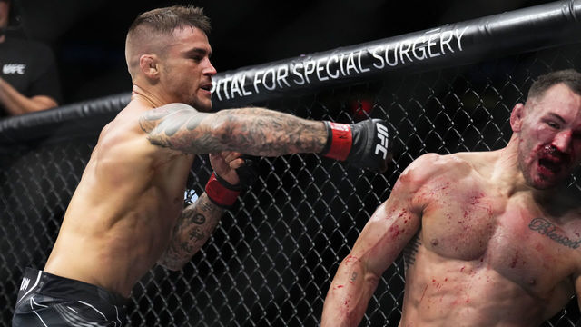 NEW YORK, NEW YORK - NOVEMBER 12: (L-R) Dustin Poirier punches Michael Chandler in a lightweight bout during the UFC 281 event at Madison Square Garden on November 12, 2022 in New York City.