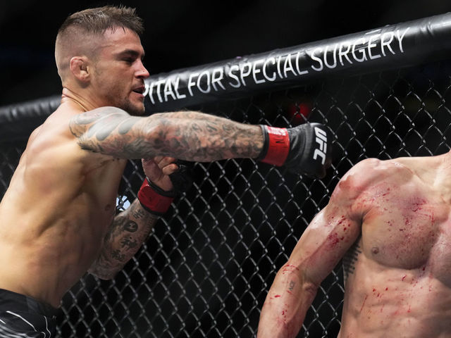 NEW YORK, NEW YORK - NOVEMBER 12: (L-R) Dustin Poirier punches Michael Chandler in a lightweight bout during the UFC 281 event at Madison Square Garden on November 12, 2022 in New York City.