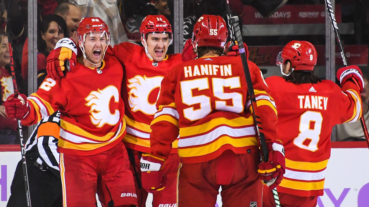 CALGARY, CANADA - NOVEMBER 12: Trevor Lewis #22 (L) of the Calgary Flames celebrates with his teammates after scoring against the Winnipeg Jets during the second period of an NHL game at Scotiabank Saddledome on November 12, 2022 in Calgary, Alberta, Canada.