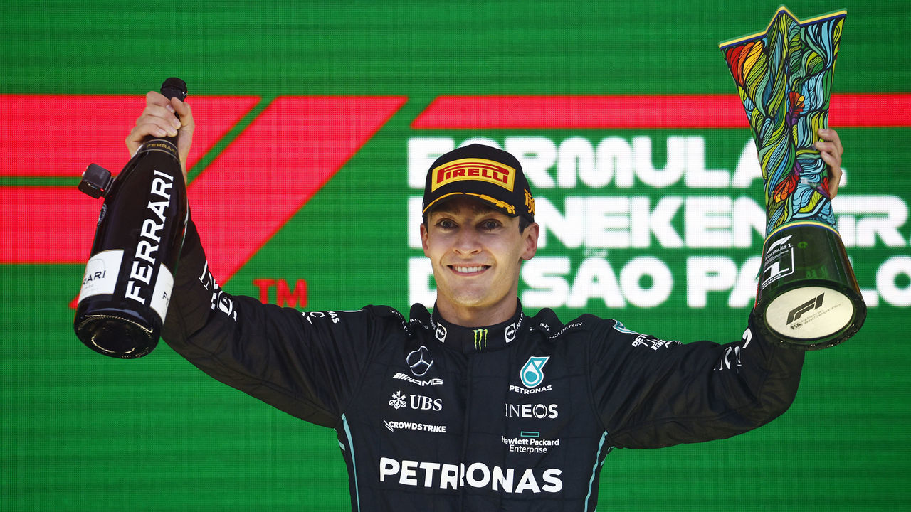 SAO PAULO, BRAZIL - NOVEMBER 13: Race winner George Russell of Great Britain and Mercedes celebrates on the podium during the F1 Grand Prix of Brazil at Autodromo Jose Carlos Pace on November 13, 2022 in Sao Paulo, Brazil.