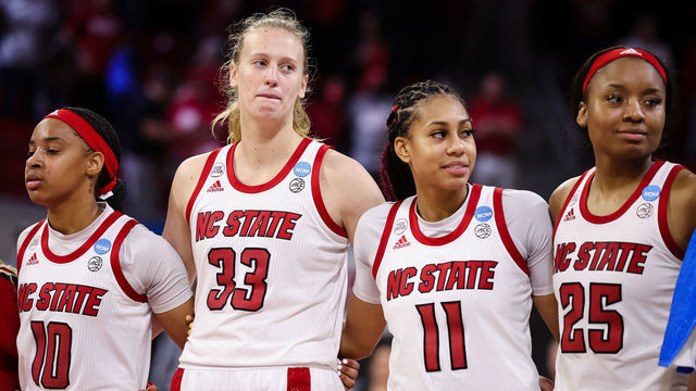 RALEIGH, NC - MARCH 19: Aziaha James #10, Elissa Cunane #33, Jakia Brown-Turner #11, and Kayla Jones #25 of the NC State Wolfpack stand together after the first round game of the 2022 NCAA Women's Basketball Tournament against the Longwood Lancers at Reynolds Coliseum on March 19, 2022 in Raleigh, North Carolina.