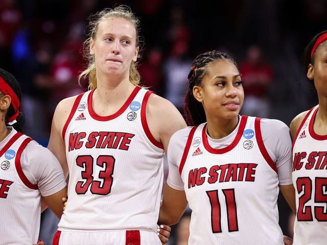 RALEIGH, NC - MARCH 19: Aziaha James #10, Elissa Cunane #33, Jakia Brown-Turner #11, and Kayla Jones #25 of the NC State Wolfpack stand together after the first round game of the 2022 NCAA Women's Basketball Tournament against the Longwood Lancers at Reynolds Coliseum on March 19, 2022 in Raleigh, North Carolina.