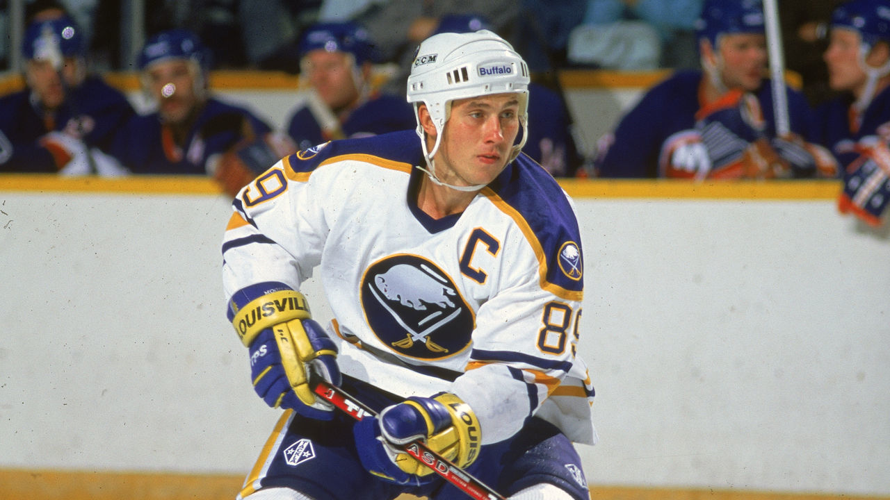 Russian hockey player Alexander Mogilny of the Buffalo Sabres skates on the ice during a game against the New York Islanders, mid 1990s.