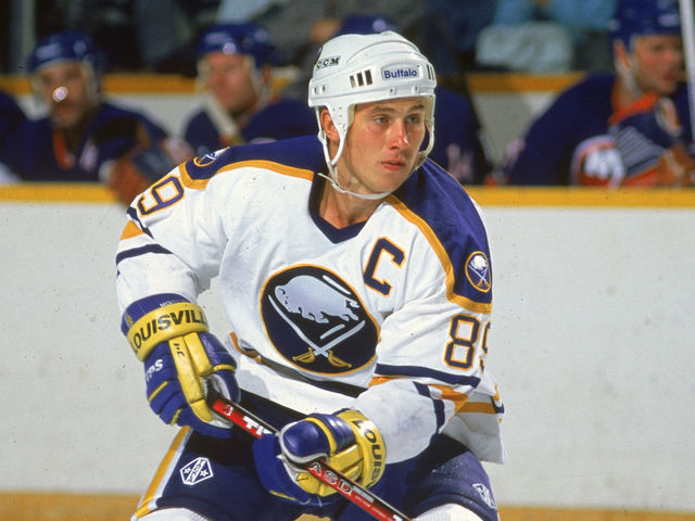 Russian hockey player Alexander Mogilny of the Buffalo Sabres skates on the ice during a game against the New York Islanders, mid 1990s.