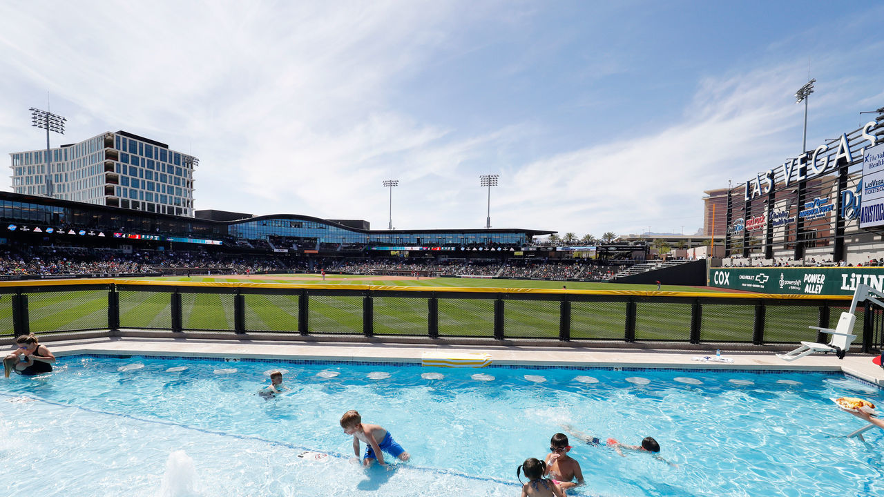 LAS VEGAS, NV - APRIL 10: General view of the field and young fans swimming in the Oasis pool during a Triple-A Minor League Baseball game between the Reno Aces and the Las Vegas Aviators on April 10, 2022 at the Las Vegas Ballpark in Las Vegas, Nevada.