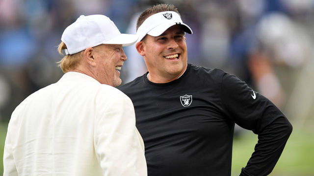 CANTON, OHIO - AUGUST 04: Head coach Josh McDaniels of the Las Vegas Raiders (R) talks with Raiders owner Mark Davis prior to the 2022 Pro Hall of Fame Game against the Jacksonville Jaguars at Tom Benson Hall Of Fame Stadium on August 04, 2022 in Canton, Ohio.