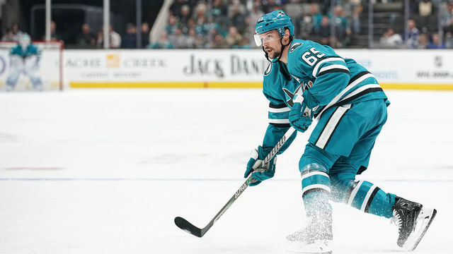 SAN JOSE, CA - OCTOBER 29: Erik Karlsson #65 of the San Jose Sharks passes the puck against the Tampa Bay Lightning at SAP Center on October 29, 2022 in San Jose, California.
