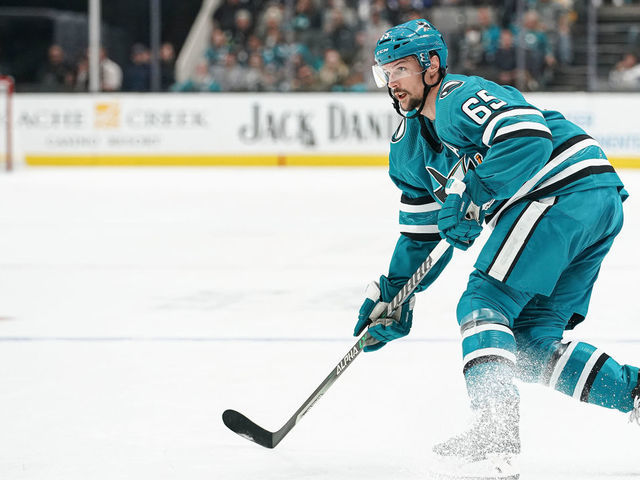 SAN JOSE, CA - OCTOBER 29: Erik Karlsson #65 of the San Jose Sharks passes the puck against the Tampa Bay Lightning at SAP Center on October 29, 2022 in San Jose, California.