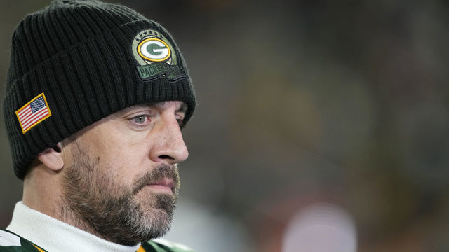 GREEN BAY, WISCONSIN - NOVEMBER 13: Aaron Rodgers #12 of the Green Bay Packers is interviewed on the field after an overtime win over the Dallas Cowboys at Lambeau Field on November 13, 2022 in Green Bay, Wisconsin.