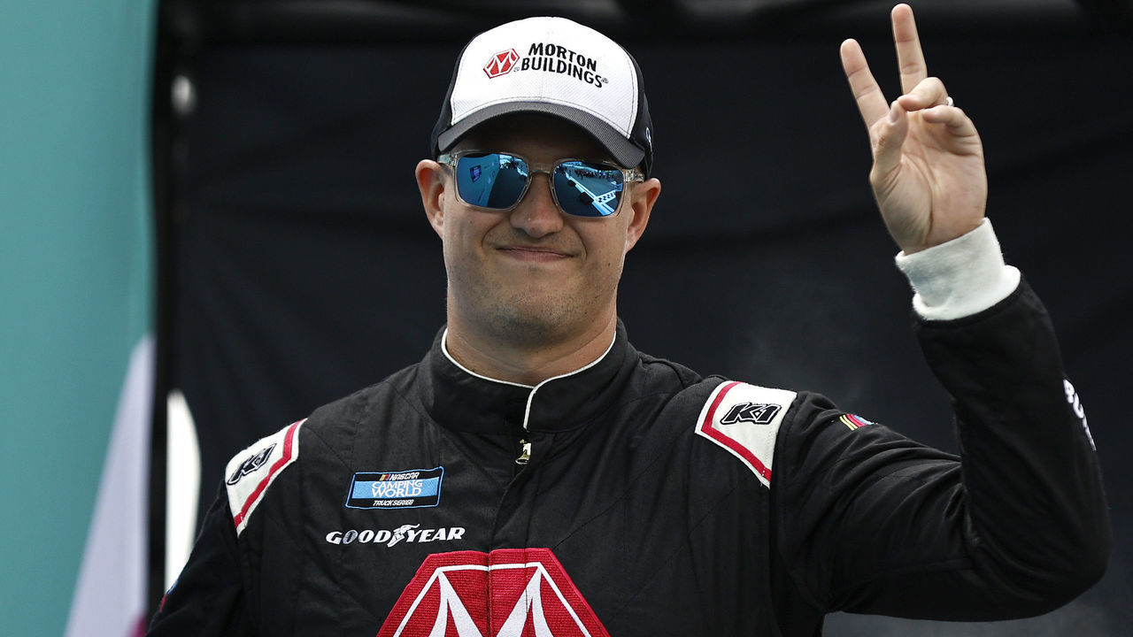 HOMESTEAD, FLORIDA - OCTOBER 22: Ryan Preece, driver of the #17 Compustar/RaceChoice Ford, waves to fans as he walks onstage during driver intros prior to the NASCAR Camping World Truck Series Baptist Health 200 at Homestead-Miami Speedway on October 22, 2022 in Homestead, Florida.
