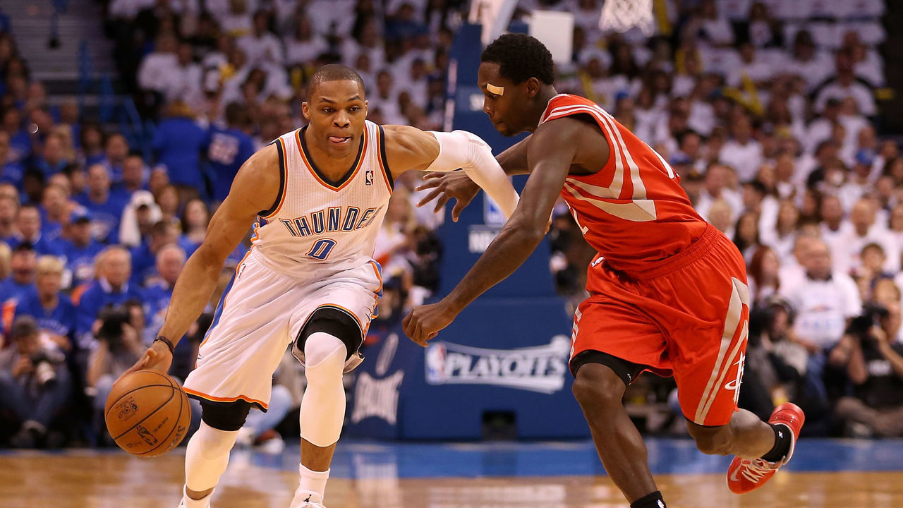 OKLAHOMA CITY, OK - APRIL 24: Russell Westbrook #0 of the Oklahoma City Thunder drives the ball past Patrick Beverley #12 of the Houston Rockets during the first quarter of Game Two of the Western Conference Quarterfinals of the 2013 NBA Playoffs at Chesapeake Energy Arena on April 24, 2013 in Oklahoma City, Oklahoma.