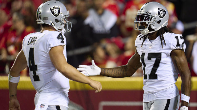 KANSAS CITY, MO - OCTOBER 10: Davante Adams #17 of the Las Vegas Raiders celebrates after scoring a touchdown with teammate Derek Carr #4 against the Kansas City Chiefs during the second half at GEHA Field at Arrowhead Stadium on October 10, 2022 in Kansas City, Missouri.