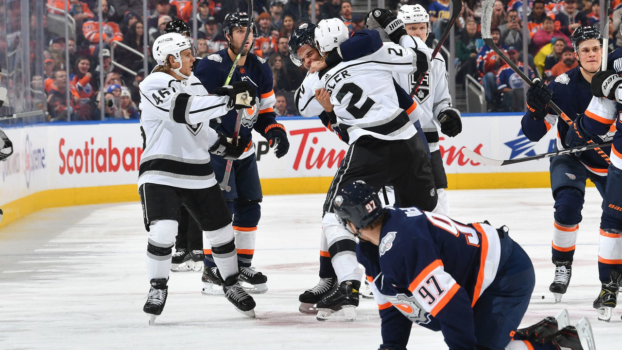 EDMONTON, CANADA - NOVEMBER 16: Connor McDavid #97 of the Edmonton Oilers looks on while Darnell Nurse #25 scrums with Alexander Edler #2 of the Los Angeles Kings during the game on November 16, 2022 at Rogers Place in Edmonton, Alberta, Canada.