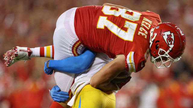 KANSAS CITY, MISSOURI - SEPTEMBER 15: Derwin James Jr. #3 of the Los Angeles Chargers lifts and slams Travis Kelce #87 of the Kansas City Chiefs during the third quarter at Arrowhead Stadium on September 15, 2022 in Kansas City, Missouri.