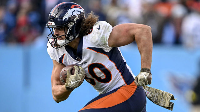 NASHVILLE, TN - NOVEMBER 13: Greg Dulcich (80) of the Denver Broncos runs as Joshua Kalu (28) of the Tennessee Titans pursues during the fourth quarter of the Titans 17-10 win at Nissan Stadium in Nashville, Tennessee on Sunday, November 13, 2022.