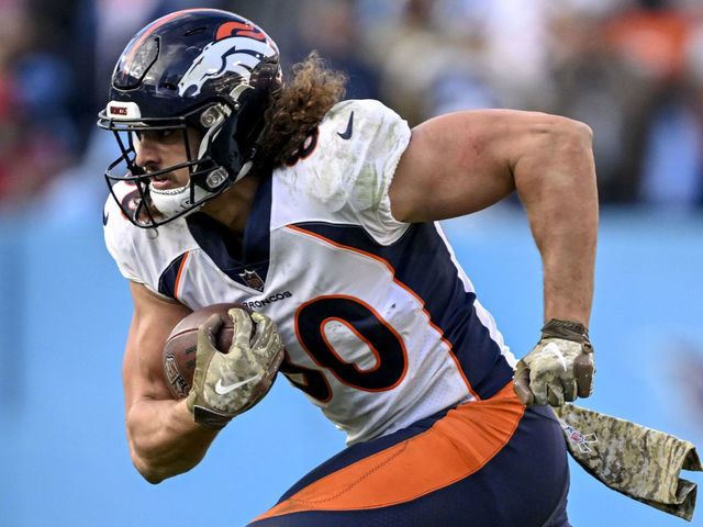 NASHVILLE, TN - NOVEMBER 13: Greg Dulcich (80) of the Denver Broncos runs as Joshua Kalu (28) of the Tennessee Titans pursues during the fourth quarter of the Titans 17-10 win at Nissan Stadium in Nashville, Tennessee on Sunday, November 13, 2022.