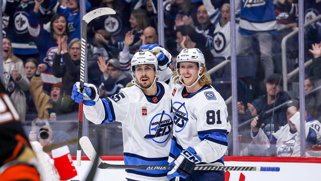 WINNIPEG, CANADA - NOVEMBER 17: Mark Scheifele #55 and Kyle Connor #81 of the Winnipeg Jets celebrate a second period goal against the Anaheim Ducks at the Canada Life Centre on November 17, 2022 in Winnipeg, Manitoba, Canada.