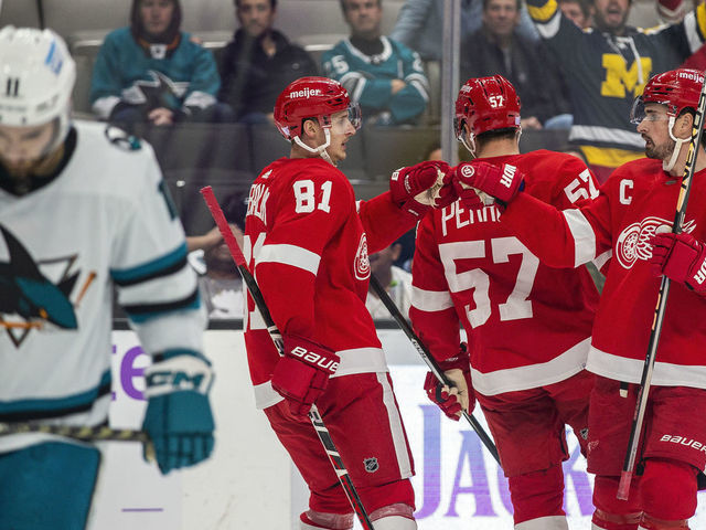SAN JOSE, CA - NOVEMBER 17: Detroit Red Wings Left Wing Dominik Kubalik (81) celebrates his empty-net goal with Center Dylan Larkin (71) during the third period of a regular season NHL hockey game between the Detroit Red Wings and the San Jose Sharks on November 17, 2022, at SAP Center, in San Jose, CA.