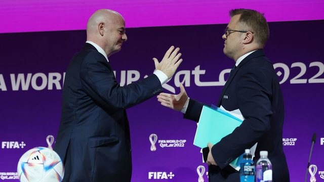DOHA, QATAR - NOVEMBER 19: FIFA President Gianni Infantino Shakes hand with FIFA Director of Media Relations Bryan Swanson attend the FIFA President Press Conference at Virtual Stadium 1 at MMC on November 19, 2022 in Doha, Qatar.