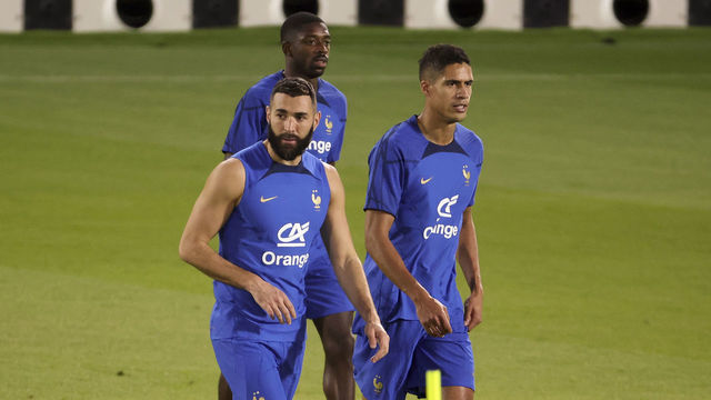 DOHA, QATAR - NOVEMBER 19: Karim Benzema, Raphael Varane, behind Ousmane Dembele of France during Team France practice ahead of the FIFA World Cup Qatar 2022 at Al Sadd SC Stadium on November 19, 2022 in Doha, Qatar.