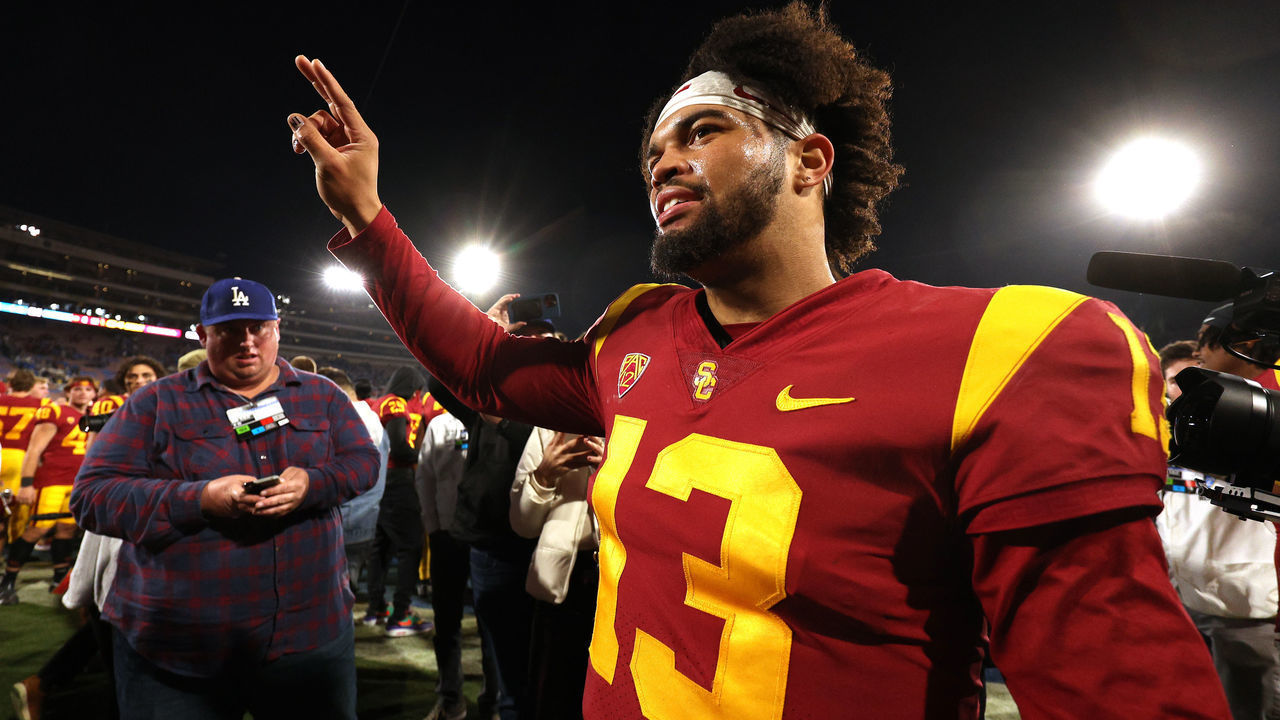 PASADENA, CALIFORNIA - NOVEMBER 19: Caleb Williams #13 of the USC Trojans celebrates after defeating the UCLA Bruins in the game at Rose Bowl on November 19, 2022 in Pasadena, California. The USC Trojans defeated the UCLA Bruins with a score of 48 to 45.