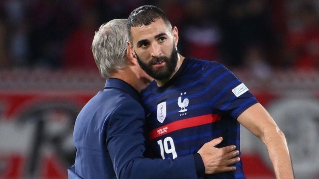 France's forward Karim Benzema (R) is embraced by France's head coach Didier Deschamps after the UEFA Nations League football match Austria v France at the Ernst Happel stadium in Vienna, Austria on June 10, 2022.