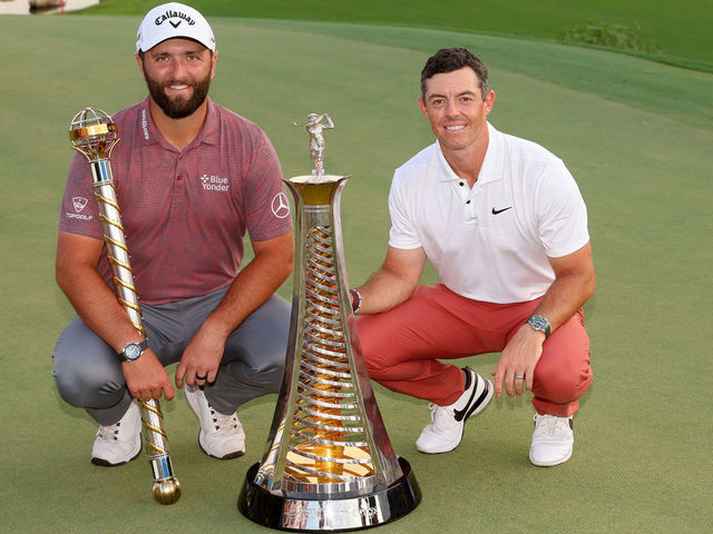 DUBAI, UNITED ARAB EMIRATES - NOVEMBER 20: Jon Rahm of Spain (L) and Rory McIlroy of Northern Ireland pose with their trophies during Day Four of the DP World Tour Championship on the Earth Course at Jumeirah Golf Estates on November 20, 2022 in Dubai, United Arab Emirates.